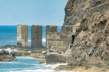 Santa Catalina beach. Huge concrete piers for davit and the ruins of the old Hermigua port used for export of bananas and other agricultural products. Telephoto lens. La Gomera, Canary Islands, Spain