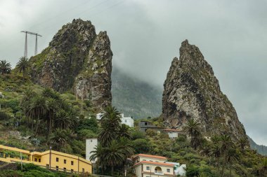 San Pedro Rocks - volcanic twin mountains, natural landmark of La Hermigua in the northeastern La Gomera Canary Islands Spain clipart