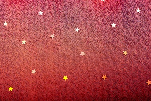 Colorful confetti stars on a colorful background