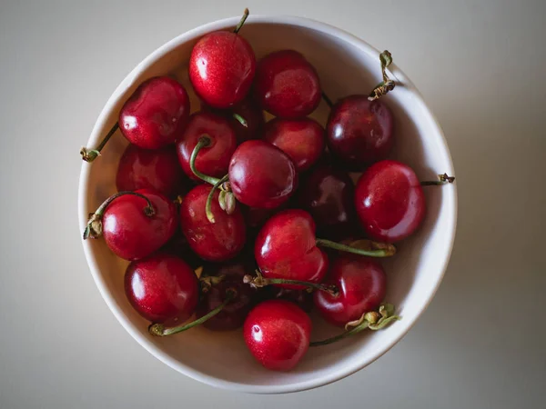 Red cherries in a bowl — Stock Photo, Image