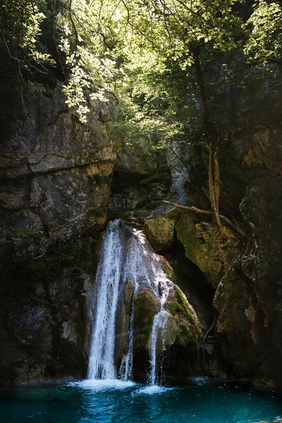 Beautiful hidden waterfall inside the forest in Pyrenees