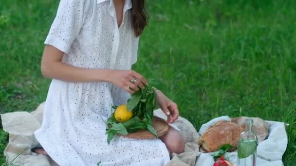 Beautiful Young Girl White Dress Sits Mat Holding Wooden Stand — Stock Video