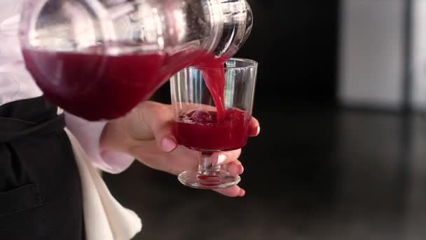 Waitress Uniform Holds Transparent Glass Thick Stem Her Hand Pours — Stock Video