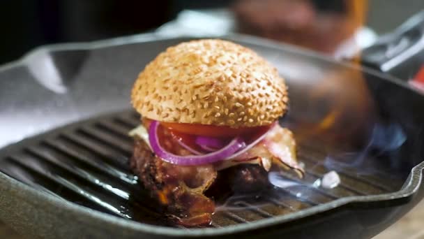 Freshly Cooked Burger Burns Pan Flame Fire Burnt Bun Sesame — Stock Video