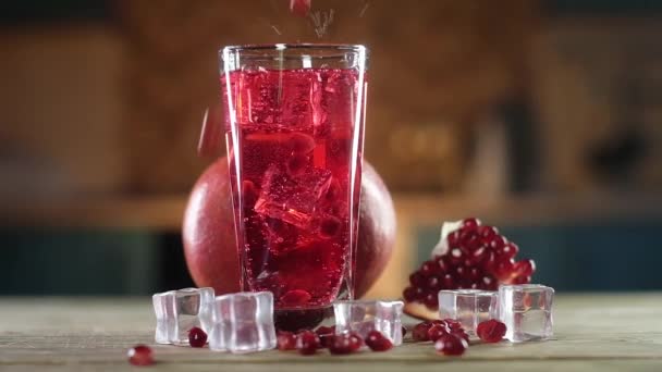 Ripe Pomegranate Seeds Fall Red Carbonated Cocktail Large Transparent Glass — Stock Video