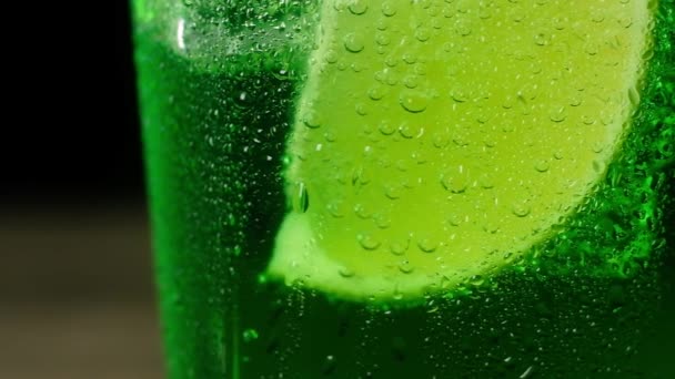 Juicy Fresh Slice Green Lime Bottom Glass Sparkling Water Large — Stock Video