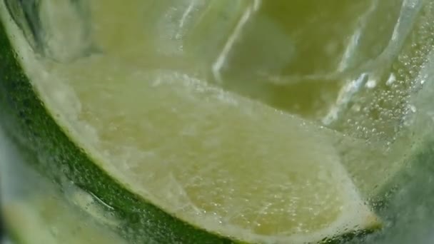 Glass Bottom Slice Fresh Juicy Lime Lot Ice Cubes Slowly — Stock Video