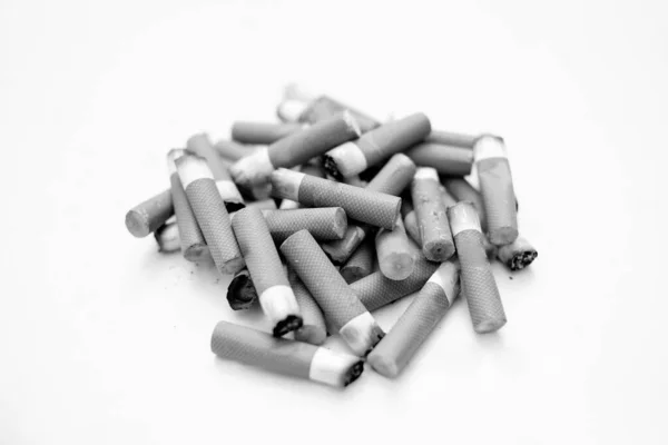 Cigarette butts isolated, stop smoke addiction concept, unhealthy pollution, bw — Stock Photo, Image