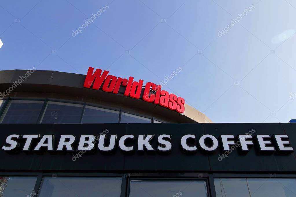 Bucharest, Romania - October 17, 2018: The signs of World Class fitness and Starbucks Coffee are present on a mall in Bucharest, Romania. This image is for editorial use only.