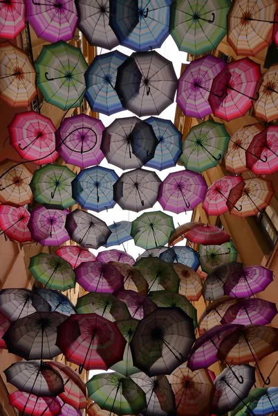 Colorful umbrellas - urban landscape - Bucharest — Stock Photo, Image