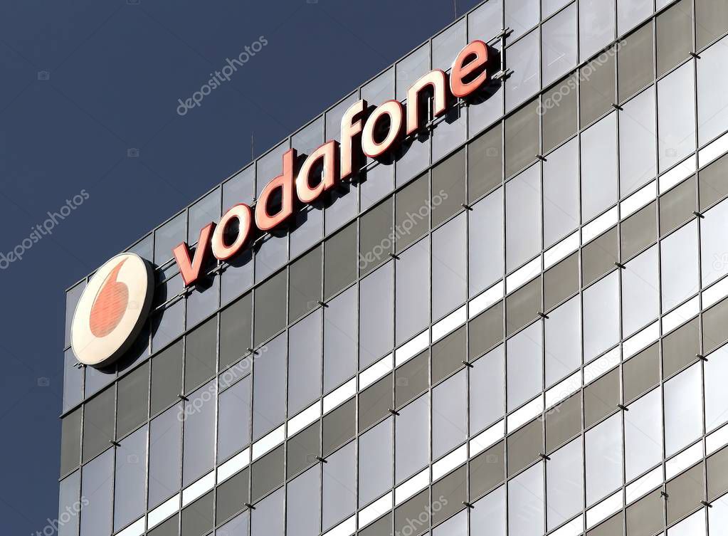 Bucharest, Romania -  October 17, 2018: A logo of Vodafone, British telecommunications company, is displayed on the top of a building, in 'Pipera' which is one of the districts with the fastest economic development in Bucharest, Romania.