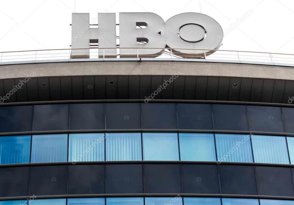 Bucharest, Romania -  Mai 01, 2019: A logo of HBO, American premium cable and satellite television network owned by AT&T's WarnerMedia, is displayed on the top of a building, in Bucharest, Romania.
