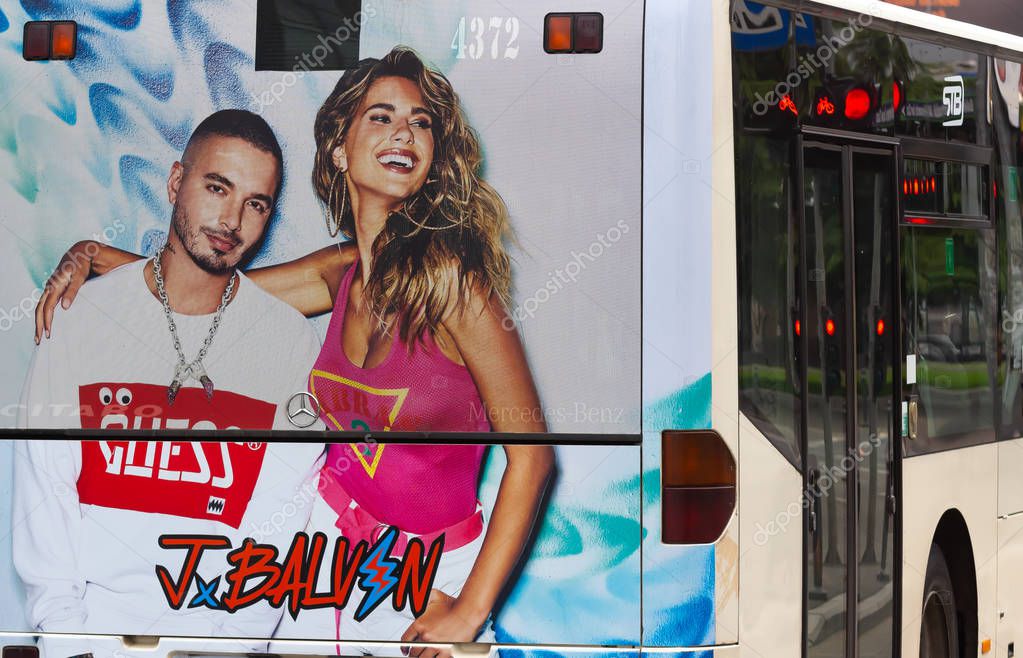 Bucharest, Romania - Mai 01, 2019: A picture of the GUESS Spring 2019 Campaign featuring J Balvin and Kara Del Toro is seen on a bus in Bucharest. This image is for editorial use only.
