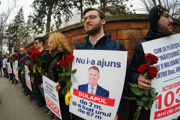 Bucharest, Romania - 1st Mar, 2024: USR members protest against Romanian President Klaus Iohannis in front of a protocol villa that is supposedly being prepared for him with expenses of 7 million euro