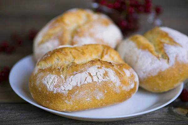 appetizing fresh bread with white powder on a plate
