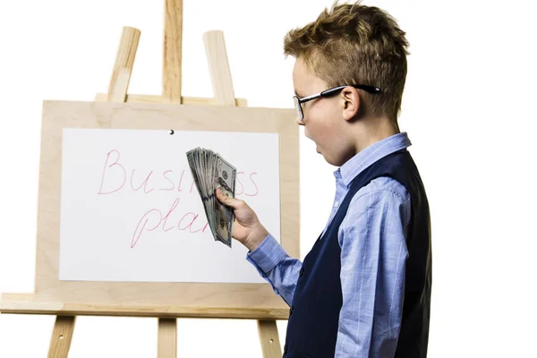 Cute Boy Holds Dollars His Hands Thinks Business Plan White — Stock Photo, Image