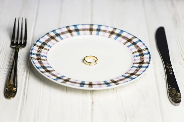 love abstraction, a ring on a plate, like food on a wooden background
