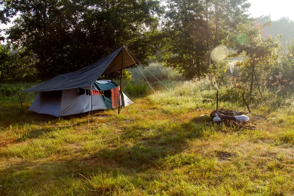 The tent in the camp is lit by the morning sun.