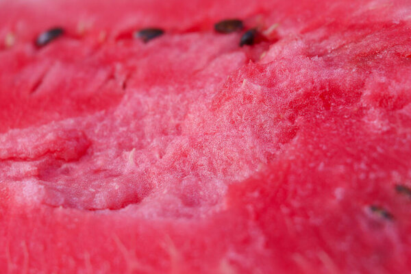 Ripe, juicy, red, sweet, flesh of watermelon close-up. Macro. Cut of red of berry, pulp texture.