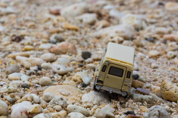 Toy 4x4 Offroad vehicle drives at the beach.