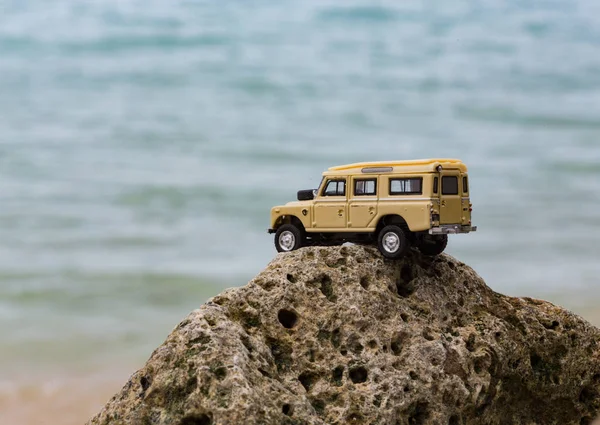 Toy 4x4 Offroad vehicle drives at the beach