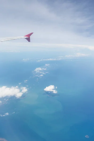 Air plane wing over the land. Can use for airline transportation background.