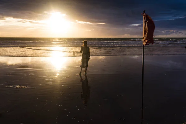 Free woman enjoying freedom feeling happy at beach at sunset. Beautiful serene relaxing woman in pure happiness and elated enjoyment with arms raised outstretched up. Asian Caucasian female model. — Stock Photo, Image