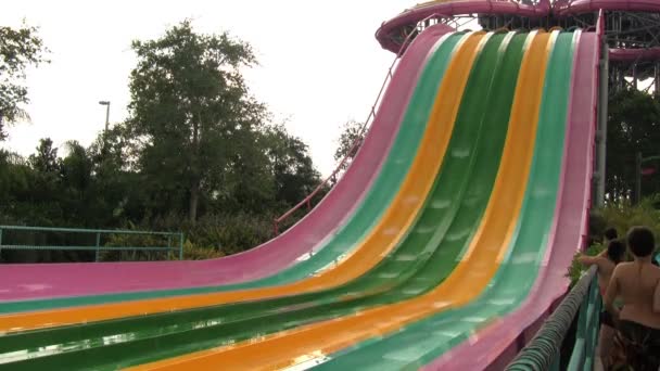 Full Shot Colorful Water Slides People Race Slope Screaming — Stock Video