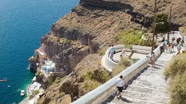 Santorini Greece Tourists and Donkeys on Historical Path Between Coast and Thira Town on a Hot and Sunny Summer Day at the Popular Greek Destination