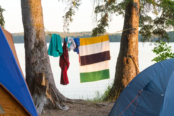 Clothes hanging to dry by tents