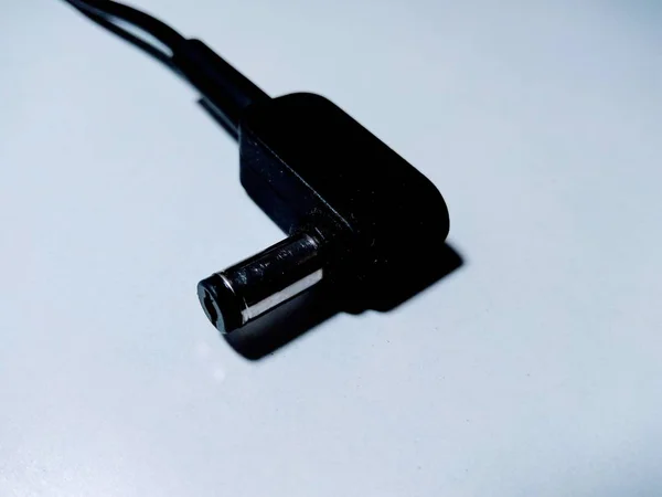 Laptop charger pin on white background