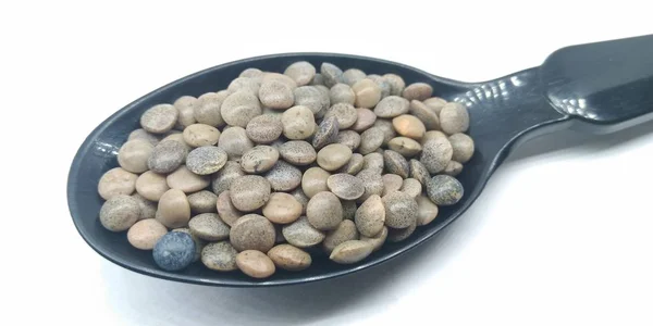 Sebuah Gambar Kacang Hitam Sendok Hitam — Stok Foto