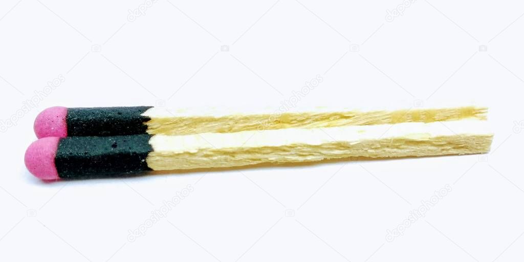 A picture of two matchsticks isolated on white background
