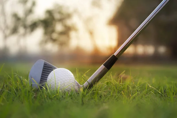 Golf clubs and golf balls on a green lawn in a beautiful golf co — Stock Photo, Image