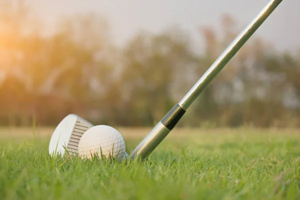 Golf clubs and golf balls on a green lawn in a beautiful golf co — Stock Photo, Image