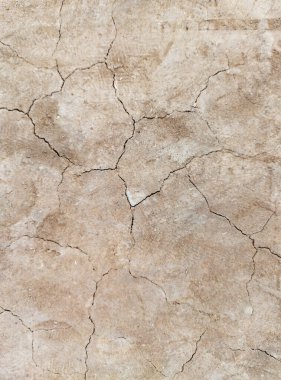 Zemin, kuraklık ve ölüm kavramına sahip arka plan veya grafik tasarımı için üst görünümde çatlaklar var..