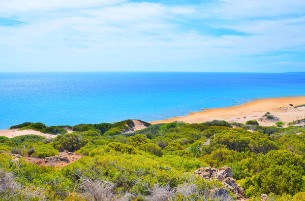 Beautiful beach background taken from the adjacent hills in remote Karpaz Peninsula, Turkish Northern Cyprus. The Cypriot sandy beaches are popular destinations for summer vacation.