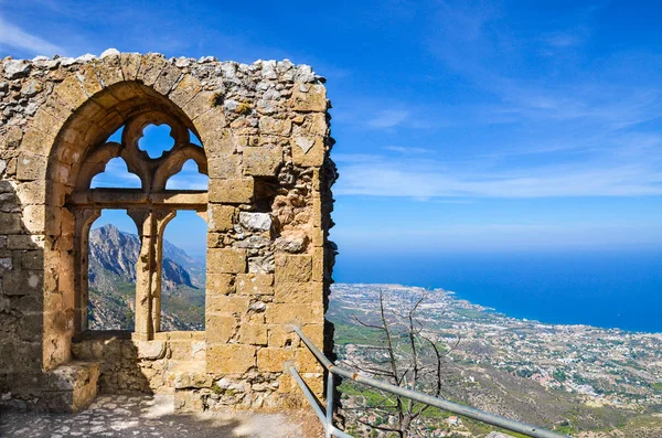 Medieval ruins of the St. Hilarion Castle offering an amazing view over the landscape of Cypriot Kyrenia region and Mediterranean. The window of the castle is a popular view point — Stock Photo, Image