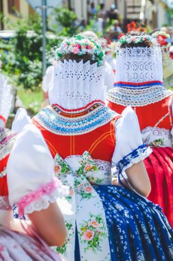 Young women during parade in traditional Czech folklore costumes. Photographed in Southern Moravia, Czechia. Moravian motifs. Festive, tradition clipart