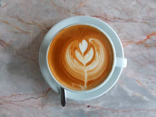 Coffee with Hot Rich Latte Art in the foam on top.