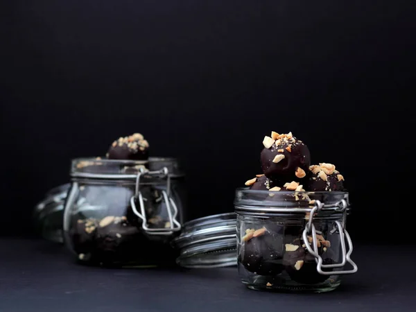 Closeup Vegan Chocolates Jar Black Background — Stock Photo, Image