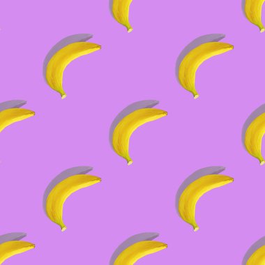 Pembe arka planda gölgesi olan muz. Kusursuz desen. Renk, diyet. Muzlu tropikal desen.