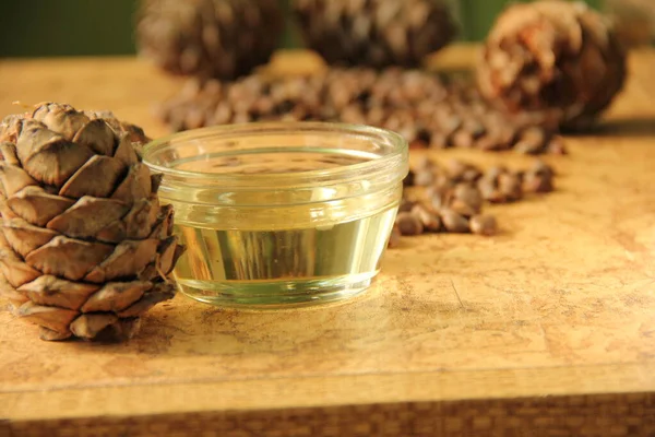 pine nuts and bottle of essential oil