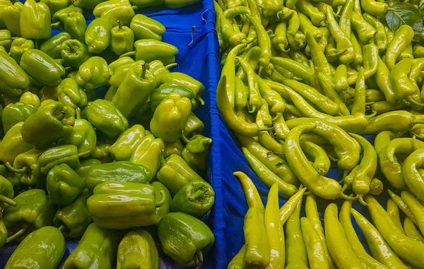 fresh green peppers at the vegetable store stand