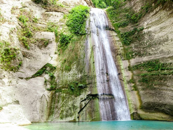 Tropical waterfall in green forest beautiful Dao Falls in jungle, Philippines, Cebu. Waterfall in the tropical forest.