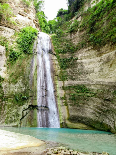 Tropical waterfall in green forest beautiful Dao Falls in jungle, Philippines, Cebu. Waterfall in the tropical forest.