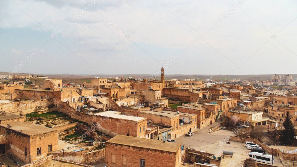 Mardin city with its traditional brown stone houses and ancient landscape in Mardin