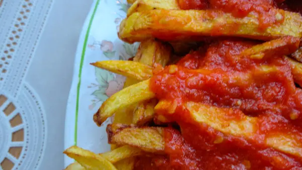 French Fries Covered Hot Organic Tomato Sauce Closeup White Plate — Stock Photo, Image