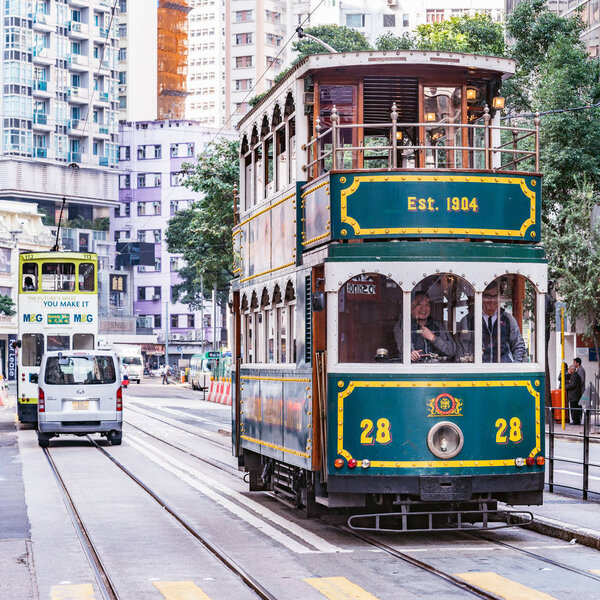 Hong Kong, China - December 15, 2016: Traditional excursional tramway on the day city street.