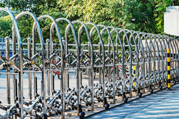 Metal fence by the stadium entrance at day time.